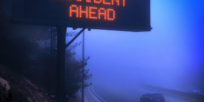 How To Drive In Bad Weather - accident ahead sign foggy mountain road.